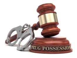 stock image of gavel and handcuffs representing drug charges